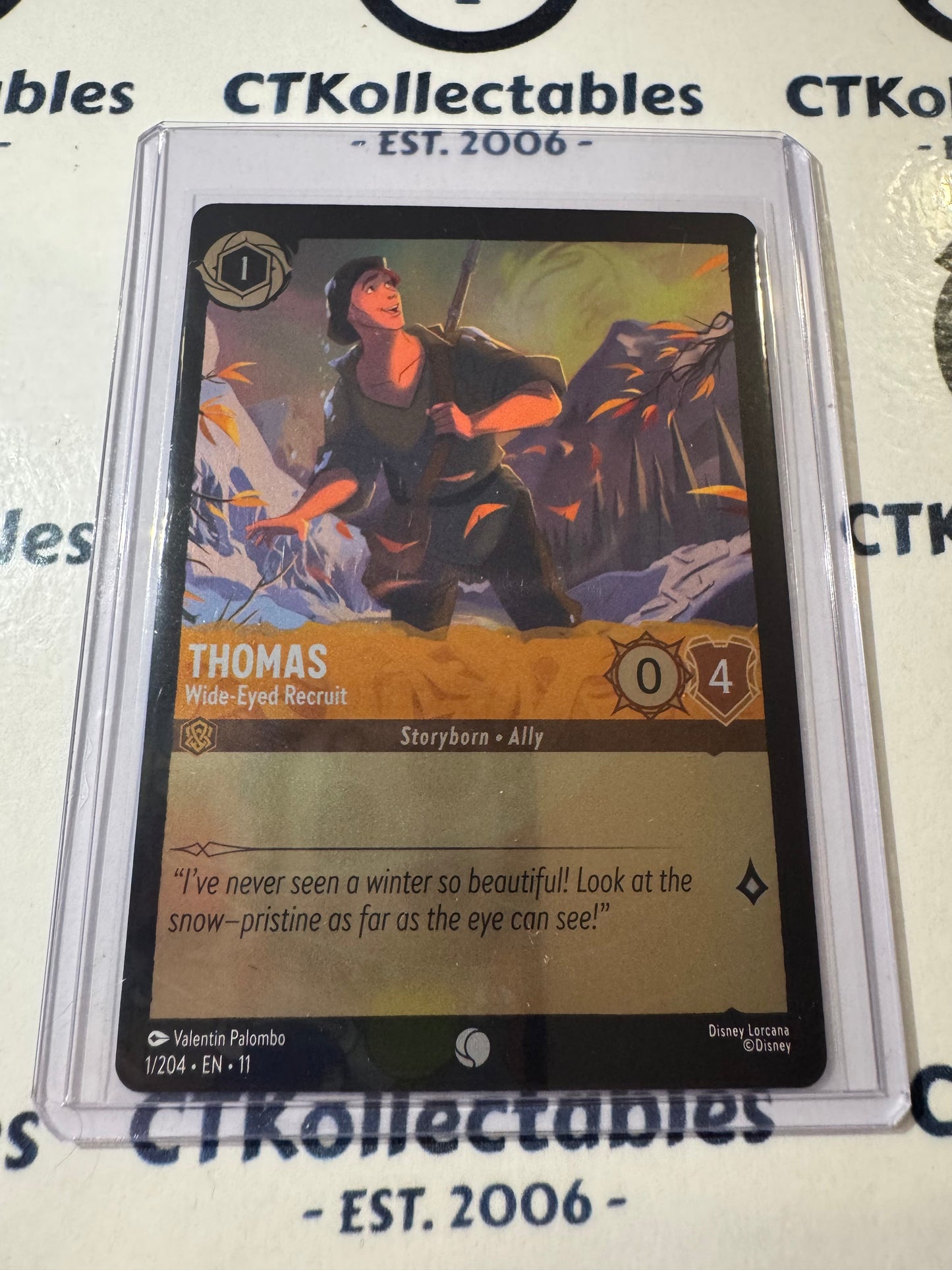 Disney Lorcana Winterspell 1/204 Thomas – Wide-Eyed Recruit FOIL C