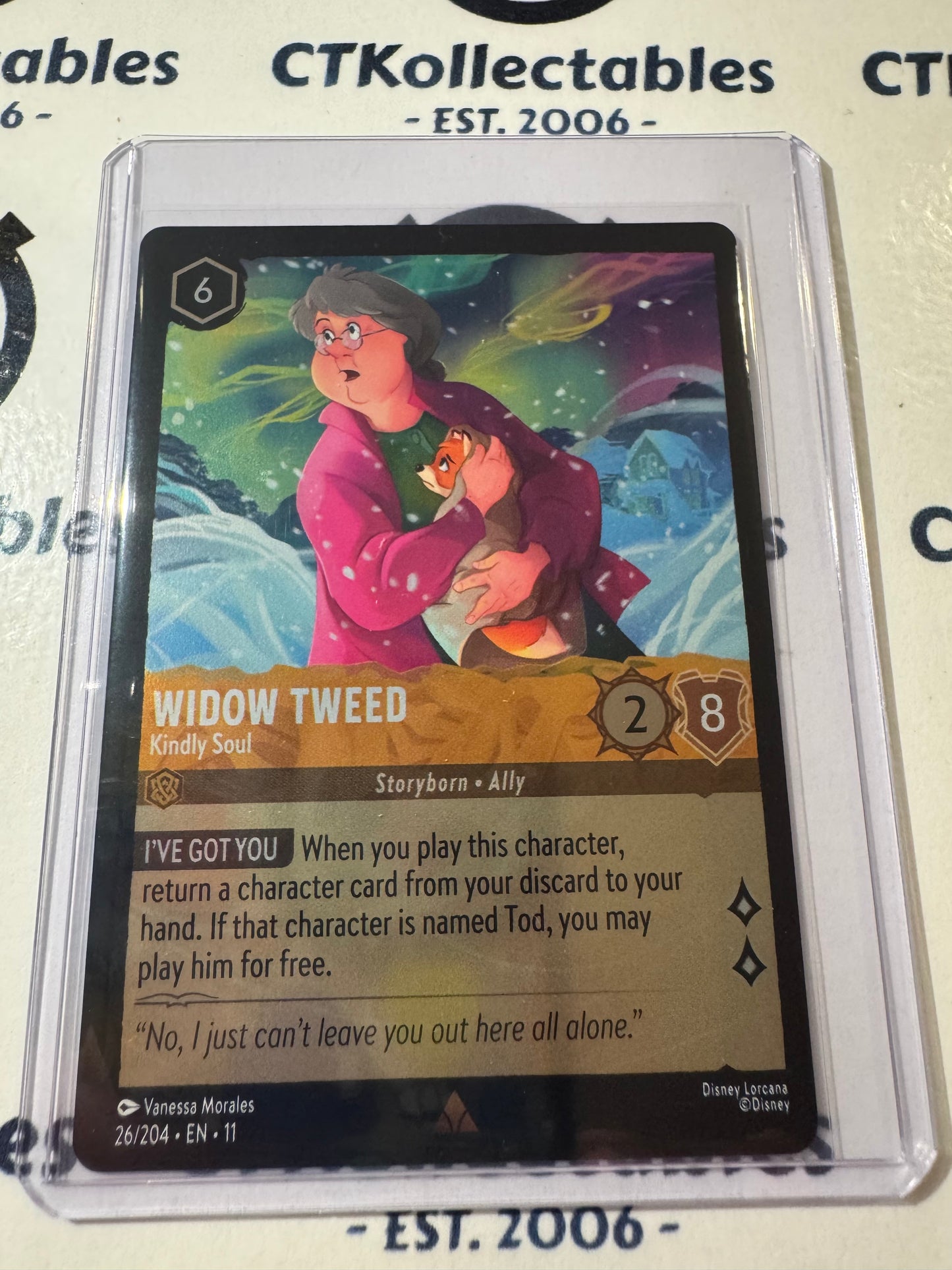 Disney Lorcana Winterspell 26/204 Widow Tweed – Kindly Soul COLD FOIL R