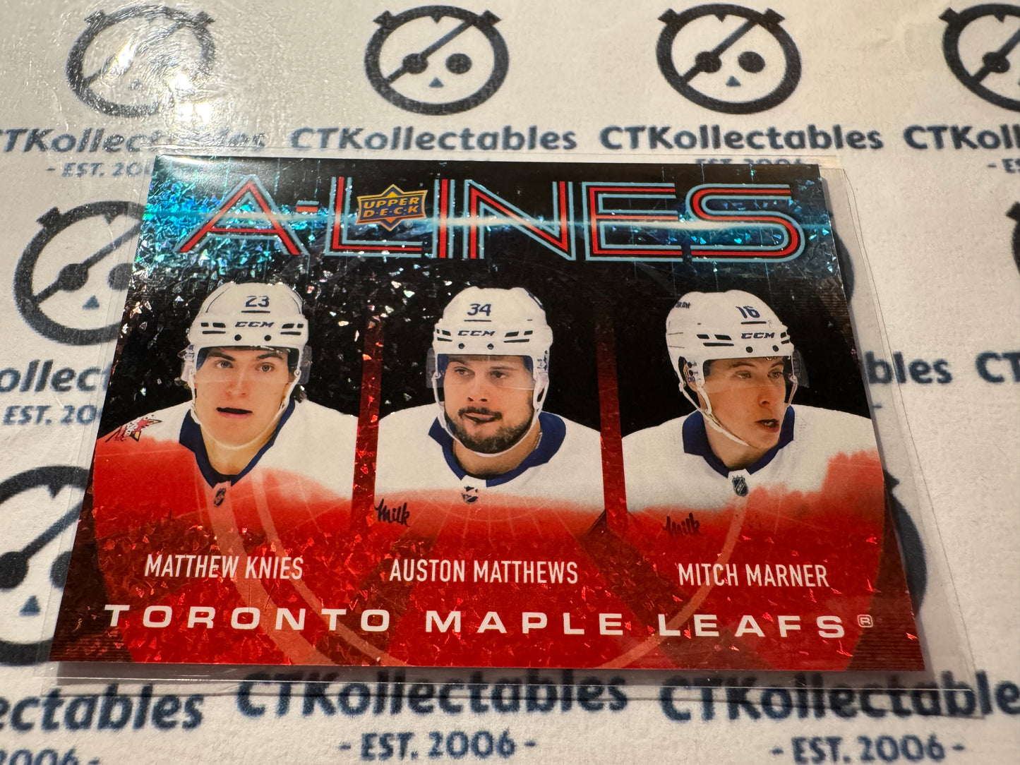 2024-25 Upper Deck Hockey Knies/Matthews/Marner A-Lines #46/99 Red Leafs AC-28
