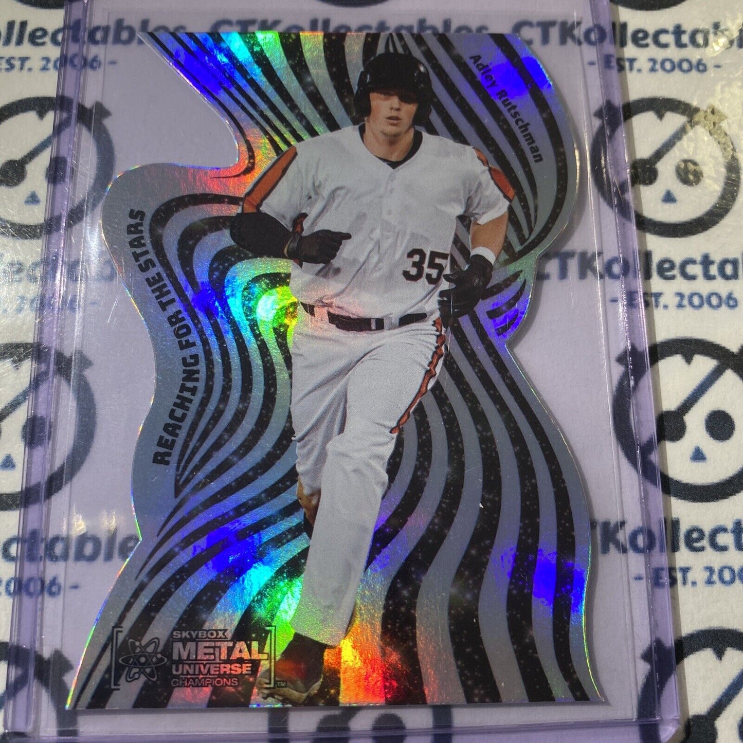 2021 Skybox Metal Universe Champions Adley Rutschman Reaching For The Stars RC