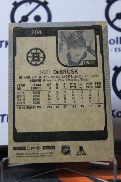 2021-22 O-PEE-CHEE JAKE DeBRUSK # 204 BOSTON BRUINS NHL HOCKEY CARD